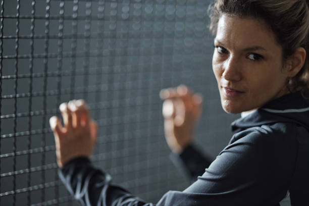 istock Sweaty athletic woman leaning on bars. 1430671761