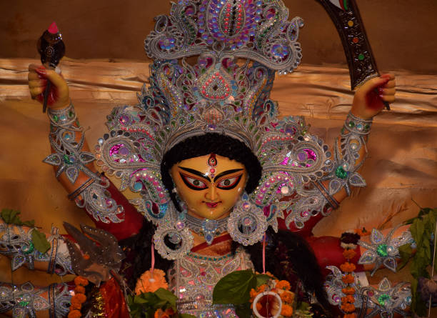 istock Goddess Durga idol front angle shot at a pandal during Durga puja festival. Durga Puja is biggest religious festival of Hinduism 1430672120