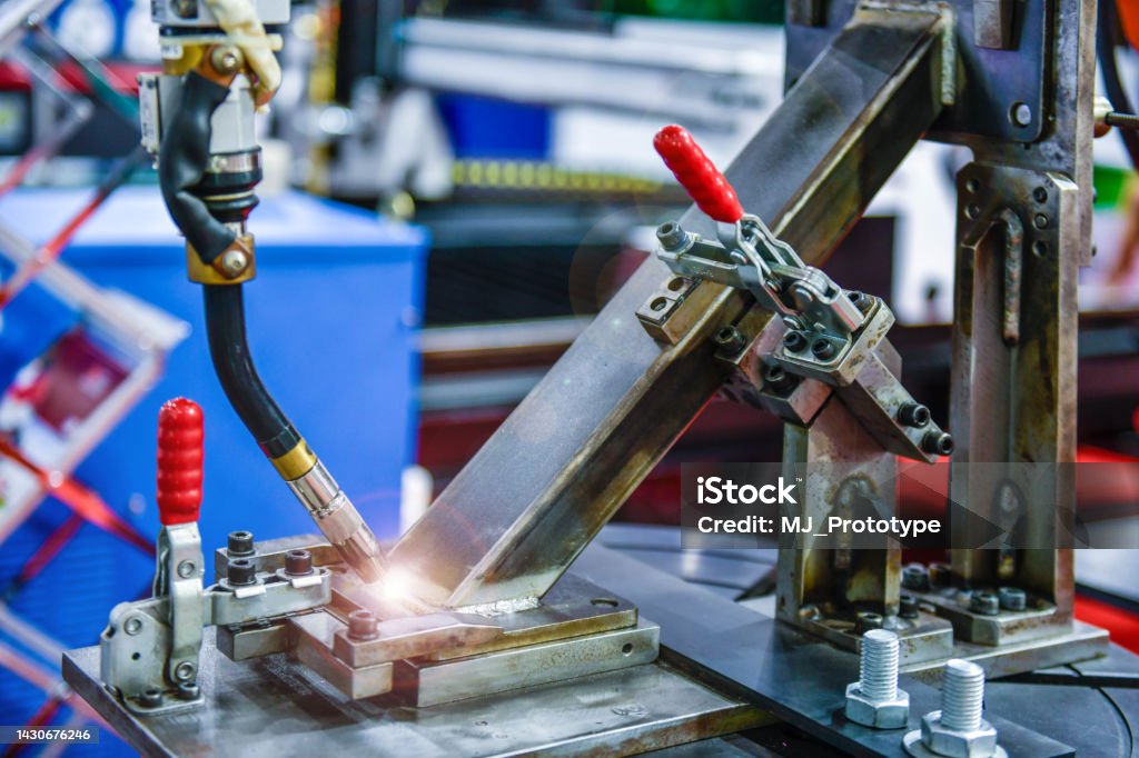 Modern high quality automation welding white robots arm at industrial Alloy Stock Photo