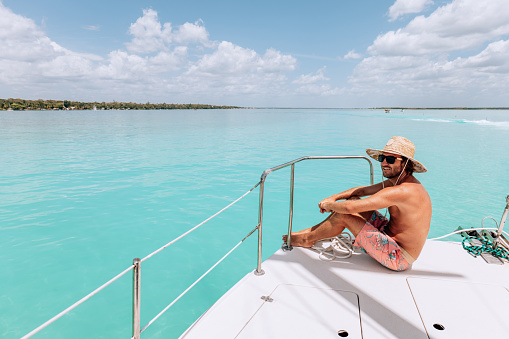 Shades of blues, solo travel male enjoying his tropical vacations.