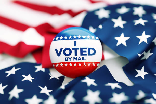 istock I Voted By Mail Written Badge Sitting Over Rippled American Flag 1430678915