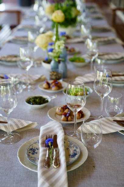 istock beautiful setting of a large table with snacks and flowers. 1430679218