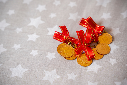 Gold coins over star shaped textile