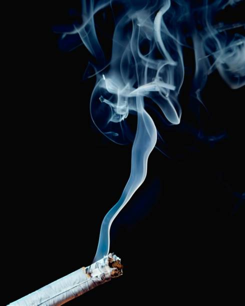 istock Smoke coming out of a cigarette, back background, 3d render 1430679492