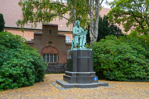 The George Robert Fountain beside Old North Church in Boston, Massachusetts, USA. There are a group of tourists being talked to by a tour guide.