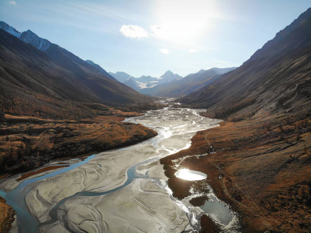 mountains glacier river valley autumn drone stock photo