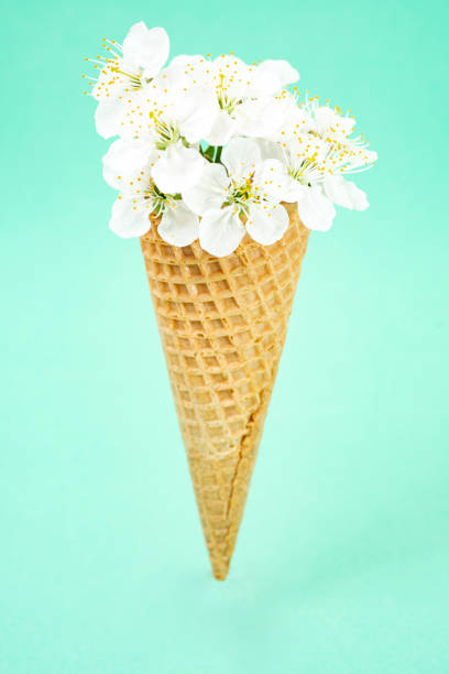 istock Ice cream waffle cone, with  apple flowers 1430685628