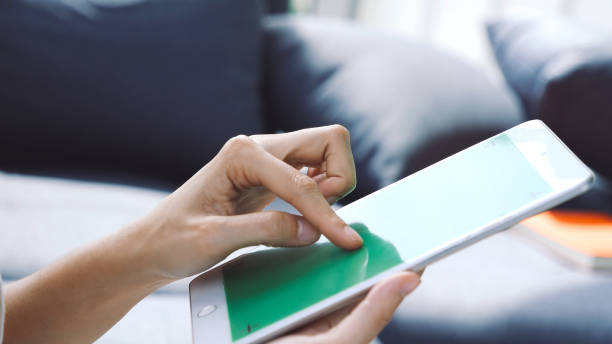 istock Asian woman using digital tablet shopping online, call, texting message internet technology lifestyle with smiling face. Asian woman touch smart tablet focus on hands using mobile app home office. 1430689949