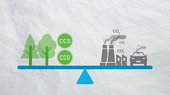 Carbon neutrality concept. Carbon dioxide reduction. CO2 gas emissions balance with carbon absorbed by trees and carbon capture technology. CO2 neutral balancing scale. Factory and transport pollution