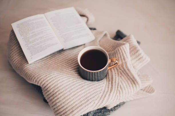 istock Cup of tea with knitted textile and paper book 1430692661
