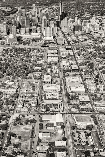 The city streets forming a pattern leading to skyline of downtown Austin, Texas from about 1500 feet in altitude during a helicopter photo flight.