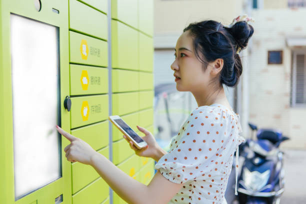 istock A woman scans the code on her mobile phone to pick up the courier at the express locker 1430694135