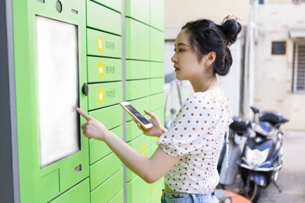 istock A woman scans the code on her mobile phone to pick up the courier at the express locker 1430694143
