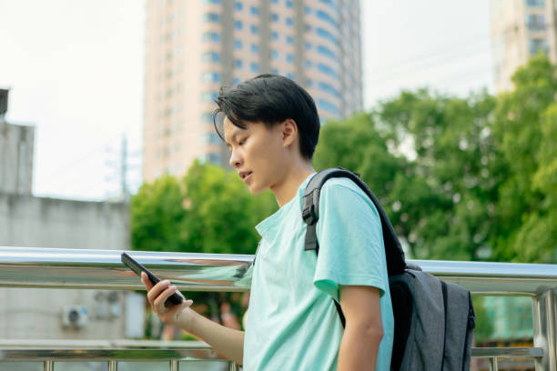 istock A man backpacker gets lost in the city using mobile phone 1430694198