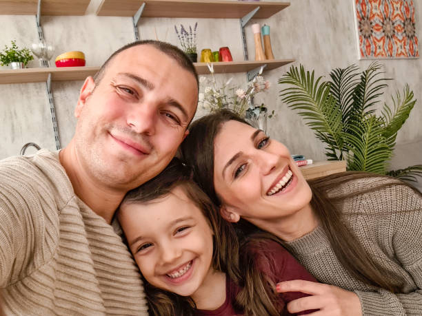 istock Happy Family Taking A Selfie Using Smart Phone 1430697425