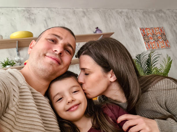 istock Happy Family Taking A Selfie Using Smart Phone 1430697480