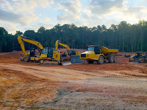 Construction Site with Heavy Equipment, Bulldozer, Dump truck, Dirt