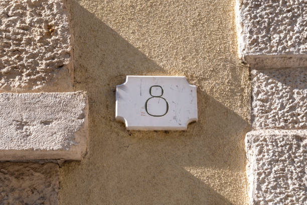 istock Number eight door number on plaster and brickwork 1430700531