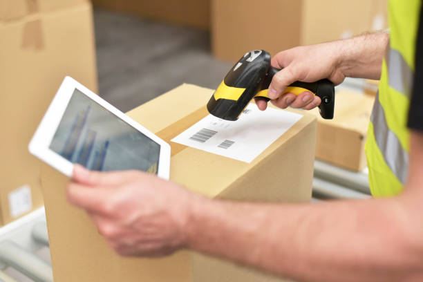 istock workers in the warehouse scanning parcels for retail and transport shipping 1430700679