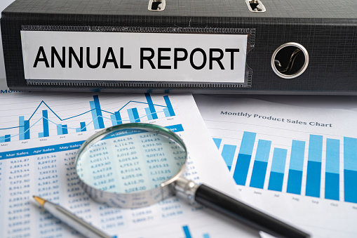 Annual Report, Binder data finance report business with graph analysis in office.