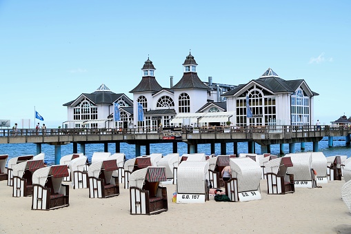 Beach chairs in front of historic jetty