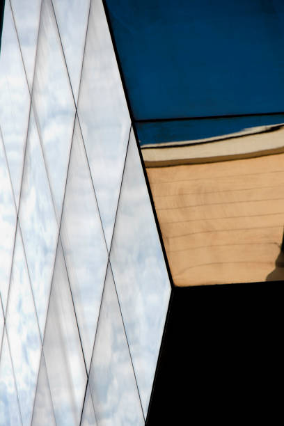 istock Architectural abstract - glass facade building with sky reflections 1430713942