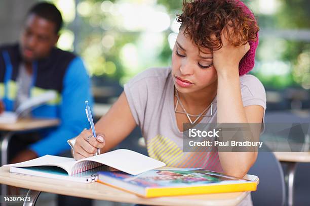 Frustrated Student At Work In Classroom Stock Photo - Download Image Now - Emotional Stress, Student, Educational Exam