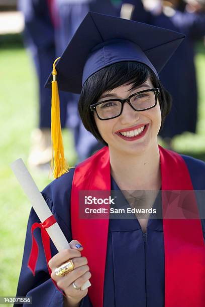 Smiling Graduate Holding Diploma Stock Photo - Download Image Now - Holding, Individuality, Single Object