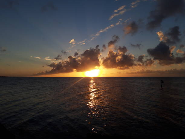 istock Sunrise cloudy beach rocky with sun raise horizontal 1430715723