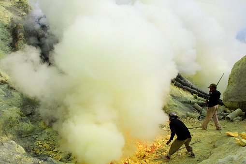 Banyuwangi, East Java, Indonesia, May 27, 2015. Sulfur miners in the Ijen crater. The health condition of miners is very risky because it is not equipped with adequate safety standard equipment.