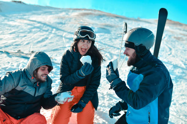 istock Friend Having Snow Eating Competition Together On Mountain 1430720313