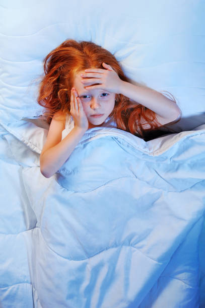 istock Depressed girl in bed having headache 1430722212