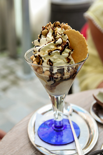 Delicious sundae with nuts and cream