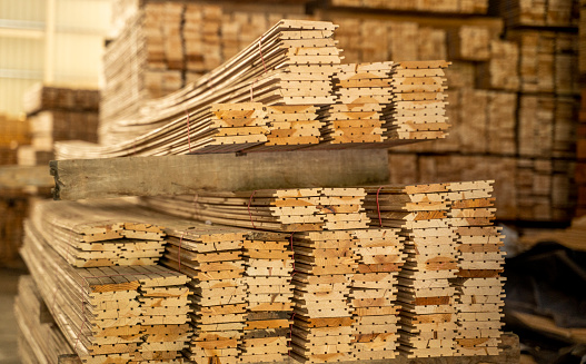 Piles of wood planks in timber yard