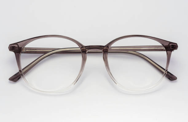 istock Eyeglass frames, lenses, various colors, both metal and plastic, on a beautiful colored background. 1430727609