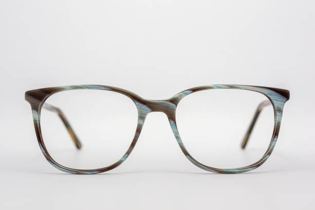 istock Eyeglass frames, lenses, various colors, both metal and plastic, on a beautiful colored background. 1430727665