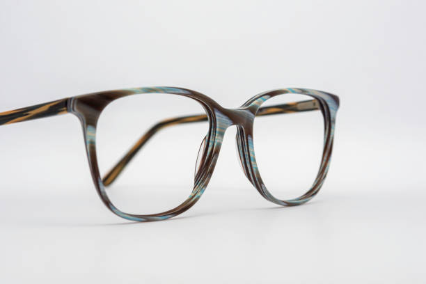 istock Eyeglass frames, lenses, various colors, both metal and plastic, on a beautiful colored background. 1430727706
