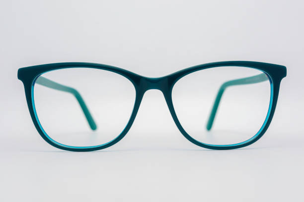 istock Eyeglass frames, lenses, various colors, both metal and plastic, on a beautiful colored background. 1430727771