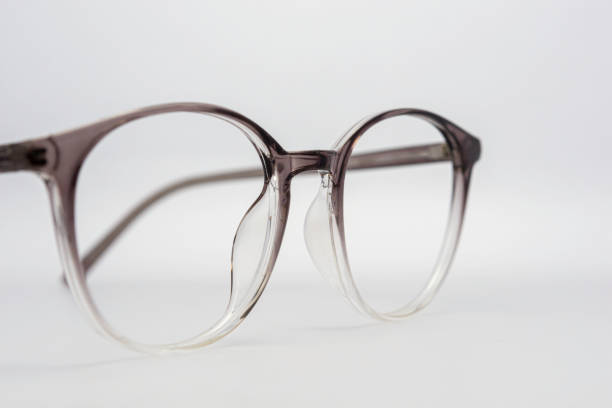istock Eyeglass frames, lenses, various colors, both metal and plastic, on a beautiful colored background. 1430727831