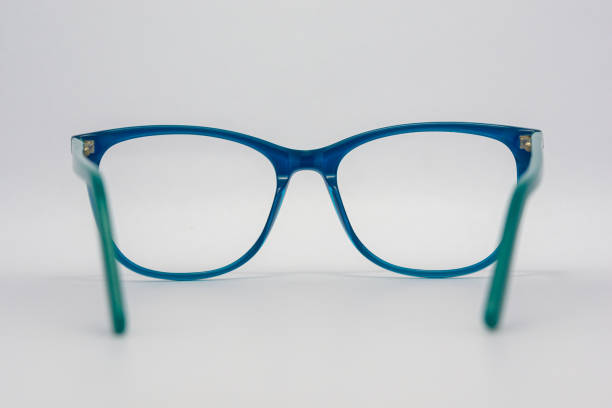 istock Eyeglass frames, lenses, various colors, both metal and plastic, on a beautiful colored background. 1430727843