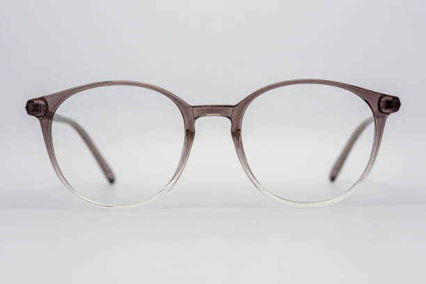 istock Eyeglass frames, lenses, various colors, both metal and plastic, on a beautiful colored background. 1430727863