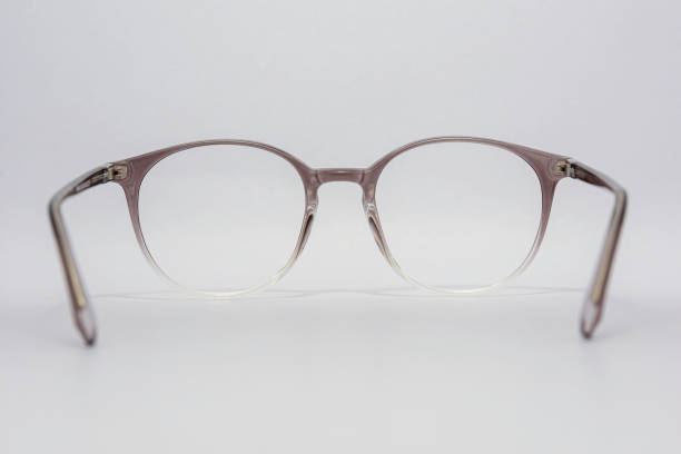 istock Eyeglass frames, lenses, various colors, both metal and plastic, on a beautiful colored background. 1430727889