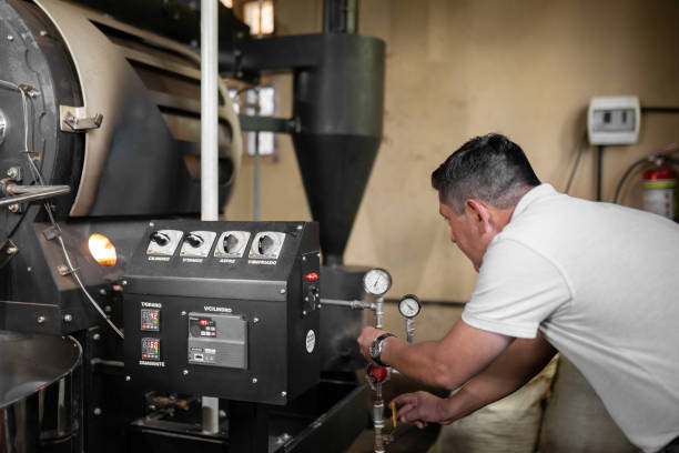 istock An Hispanic man is setting the buttons to turn on the coffee roaster machine 1430732112