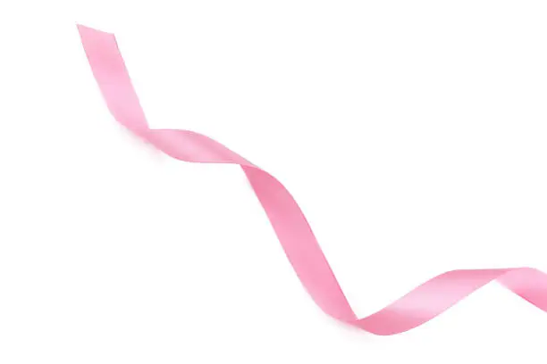 Photo of Curled pink ribbon isolated on white background