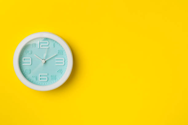 istock Blue clock on color background, top view 1430734168