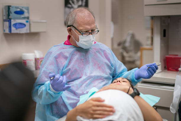 istock Dentist Working On Pregnant Patient 1430734421