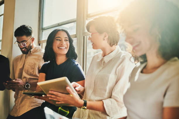 istock Millennial, young and business people creative team on digital technology, happy collaboration and motivation. Diversity of young marketing agency staff on mobile connection in startup design studio 1430735942