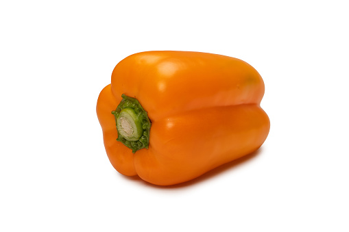 Orange bell pepper isolated on a white background. Top view.  Copy space.