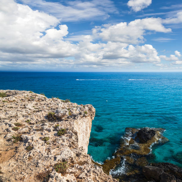 istock Coastal view with rocks and sea water under cloudy sky 1430736457