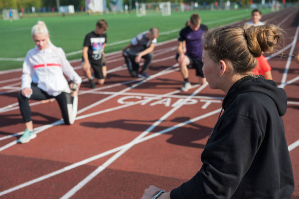 istock Female coach and group of children conducts a training session 1430736870